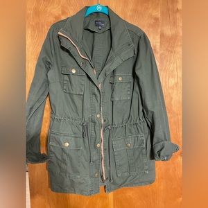 Market @ Spruce olive green jackets with coral zipper accent.